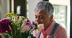 Aroma, flowers and getting ready with woman in plant nursery for retail sale of floral arrangement. Scent, small business and startup with mature florist pruning bouquet for collection or delivery