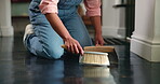 Hands, cleaning and sweeping floor in house or apartment for job, maintenance or housekeeping. Female person, worker and dirt or mess with cleaner service, domestic equipment and home improvement