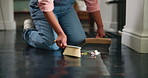 Person, hands and broom with dirt on floor for cleaning, housekeeping or chores at home. Cleaner, housekeeper or maid brushing dust, litter or rubbish for bacteria or germ removal on surface at house
