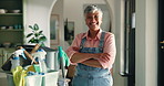 Mature, happy woman and face with cleaning supplies in confidence for housekeeping or chores. Portrait, female person or maid with smile or arms crossed for professional domestic service at house