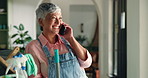 Home, phone call and old woman with smile, cleaning and communication with chore, internet and app. Pensioner, apartment and senior person with smartphone, conversation and hygiene with happiness