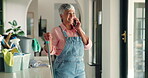 Phone call, cleaner and smile with woman in home for contact, housekeeping and maid service. Communication, spring cleaning and hygiene with mature person in house for dust, connection and talking
