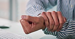Business person, hands or wrist pain with carpal tunnel syndrome for injury at office desk. Closeup, employee or journalist with sore arm, ache or discomfort for muscle tension or strain at workplace