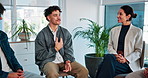 Counseling, group therapy and meeting with people in office together for advice, growth or healing. Accountability, support and workshop with man speaking to therapist in session for psychology