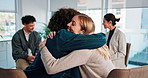 Therapy, group and people hug in circle for emotional support, help and comfort in session. Psychology, mental health and men with women embrace for counseling, awareness workshop and trauma recovery