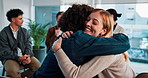 Counseling, group and people hug in circle for emotional support, help and comfort in session. Psychology, mental health and men with women embrace for therapy, awareness workshop and trauma recovery