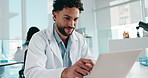 Medical research, scientist and man with laptop, lab and data analysis on website and biotechnology. Clinic, thinking and person with tech for project, typing and researcher with smile for article 