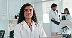 Laboratory, woman and scientist with laptop for research, investigation and confidence for report. Healthcare, female person and science expert in portrait with digital, biotechnology and medical
