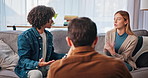 Therapy, discussion and couple on sofa with psychologist for healing marriage, conflict or infidelity. Talk, communication and back of therapist with man and woman for relationship counseling session
