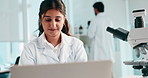 Laboratory, woman and scientist with laptop for report, investigation or confidence for research. Healthcare, female person and science expert  with digital for smile biotechnology or medical results
