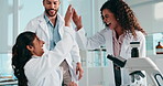 High five, team and scientists with laptop in laboratory for group goal with medical research. Happy, celebration and biologists with approval for pharmaceutical innovation, discovery or project.