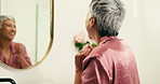 Mature, happy woman and smile with mirror for holiday, weekend or pamper at beauty salon. Senior, female person and excited with reflection in comfort for treatment day or vacation at luxury resort