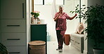 Dance, jade roller and sing with woman in bathroom of home for morning skincare routine. Beauty, energy and microphone with smile of happy senior person in apartment for antiaging dermatology