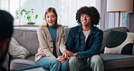 Couple, counseling and holding hands on sofa, therapist or service for pre marital course in office. Happy, man and woman with psychologist for communication skills, consultation and people on couch