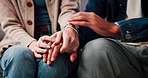 Home, couple and love with holding hands for support, partnership and commitment in relationship. Closeup, people and compassion with gesture for empathy, bonding and trust with healing in house
