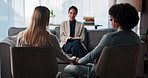 Couple, back view and meeting with therapist for counseling therapy at private session. Counsellor, holding hands and relationship in conflict resolution for marriage advice, assistance or help