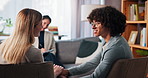 Counseling, holding hands and support with couple in therapy session for healing or resolution. Consulting, conversation or psychology with man, woman and therapist in office for reconciliation
