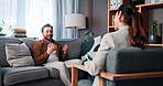 Therapy, talking and man with therapist on sofa for life coaching, support and mental health. Psychology, office and patient in discussion to learn coping skills, control emotions and counseling