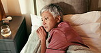 Insomnia, bedroom and senior woman with stress, thinking or depression in home with top view. Rest, sad and sleepless person in bed with reflection, remember past or worry with anxiety in retirement