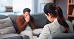Man, crying and talk with therapist for mental health, support and stress management on sofa at clinic. Woman, psychology and patient for anxiety, depression and guide with consultation on couch