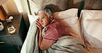 Insomnia, bedroom and senior woman with depression, thinking or stress in home with top view. Rest, sad and sleepless person in bed with reflection, remember past or worry with anxiety in retirement