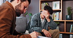 Therapy, writing and man crying on sofa for help, counseling session and emotional support. Psychology, mental health and therapist with upset and sad patient for trauma, listening and consulting