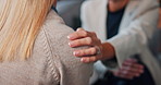 People, hands and therapy with shoulder for support, comfort or counseling session on sofa at home. Closeup, client and therapist talking with touch for empathy, sympathy or health advice at house