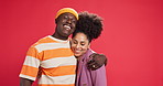 Happy, hug and face of couple in studio with gesture for bonding, commitment and relationship. Love, dating and portrait of man and woman embrace for affection, trust and care on red background