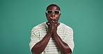 Face, sunglasses and black man with surprise in studio for news, announcement and rumor. Shock, wow and male person with secret, omg emoji and wtf reaction for gossip with drama on background space