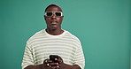 Studio, black man and face with sunglasses for phone, text message and thinking for online chat. Male person, model and fashion with mobile for app, mockup background and social media with expression