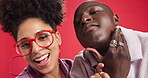 Goofy, happy and face of couple in studio with playful, funny or bonding in relationship together. Silly, laugh and portrait of woman with man for marriage connection with humor by red background.