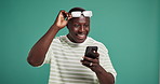 Surprise, winner and phone with black man and glasses for casino, success and competition profit. Achievement, online prize and shocked with person on green background for space, lottery and news