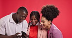Friends, group and phone with laughing in studio with smile, meme and funny video by red background. People, man and women with smartphone, joke and mobile app for sharing post on social network