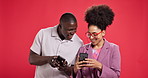 Smile, couple and phone in studio for browsing, social media and reading funny meme. Happy, African people and laughing with mobile for sharing post, online joke and notification on red background