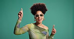 Woman, point up and sunglasses in studio, space and options with trendy style by background. Person, girl and excited with decision for mockup, fashion and announcement with pride in Costa Rica