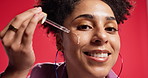 Studio, woman and face with serum for skincare, hydration and collagen treatment with cosmetics. Portrait, female person and model with pipette for facial oil, vitamin c or wellness on red background