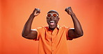 Black man, fist pump and celebration in studio with sunglasses, fashion and goals by background. African person, happy and success with cheers, trendy style and winner with scream for giveaway prize