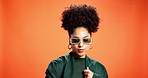 Black woman, sunglasses and pride for fashion in studio background, trendy clothes and bold style. Mockup space, female person and confidence for retro aesthetic, elegant outfit and attitude 