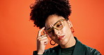 Doubt, problem solving and thinking with black woman on wall background for brainstorming solution. Afro, confused and ideas with person in orange studio for contemplation, memory or wondering
