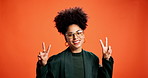 Peace sign, face and glasses with woman in studio for social media analyst, review and like. Agreement, opinion and trend specialist with person on orange background for space, emoji and kindness