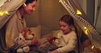 ​​Tent, mom and kid play with toy dinosaur, miniature model and bonding together in family home. Smile, parent and child with stuffed animal for game, learning and explain reptile species at night