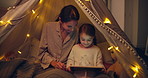 Tent, home and mother with child on tablet for playing game, bedtime story or learning. Online, parent and daughter with tech at night for movie, streaming cartoon and education with happy family