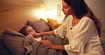 Bedroom, mother and sick with child for fever, check temperature and evening with bonding together. Night, girl and mom with hands for support, cold symptoms and conversation with caring at home