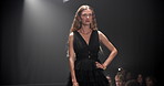 Woman, model and runway with outfit for fashion show, garment collection or designer brand. Female person, crowd or audience with clothing line for style, publicity or fashionable trend on walkway