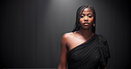 Studio, black woman and face with walking for runway, event and presentation of fashion with mockup. Female person, model and portrait with pride for clothing show, designer dress and dark background