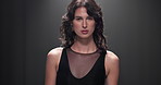 Studio, woman and face with fashion for runway, public event and presentation with outfit by mockup. Female person, model and portrait with pride for clothing show, designer brand or black background
