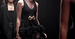 Runway, walking and models at fashion show with designer collection for luxury trendy outfit. Fabric, body and people at couture event with black clothes for formal, elegant or fancy style at catwalk