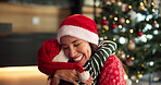 Happy, christmas and mother hugging child in home for love, care and thank you for gifts. Smile, festive holiday and mom embracing kid for family bonding, connection or gratitude on xmas in house.