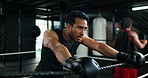 Fitness, boxing ring and tired man on rope for rest, relax and exhausted after competition. Athlete, boxer and break in gym with breathing, fatigue or workout recovery for health after fight or sport