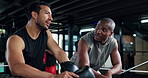 Coaching, sports people and talking in boxing ring at gym together for exercise, fitness or training. Break, conversation or workout with boxer man and personal trainer in health club for discussion